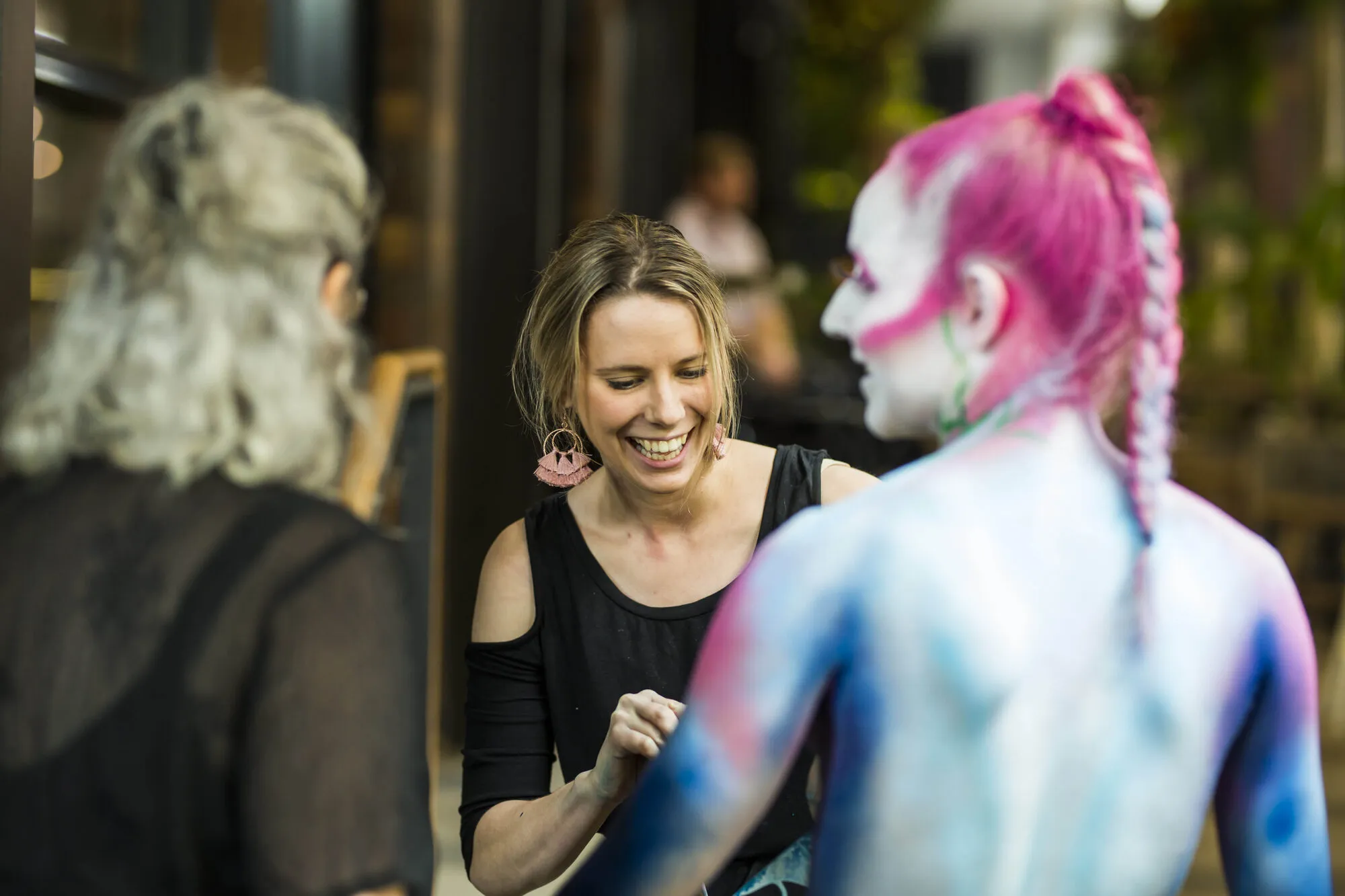 Live body painting at gallery event